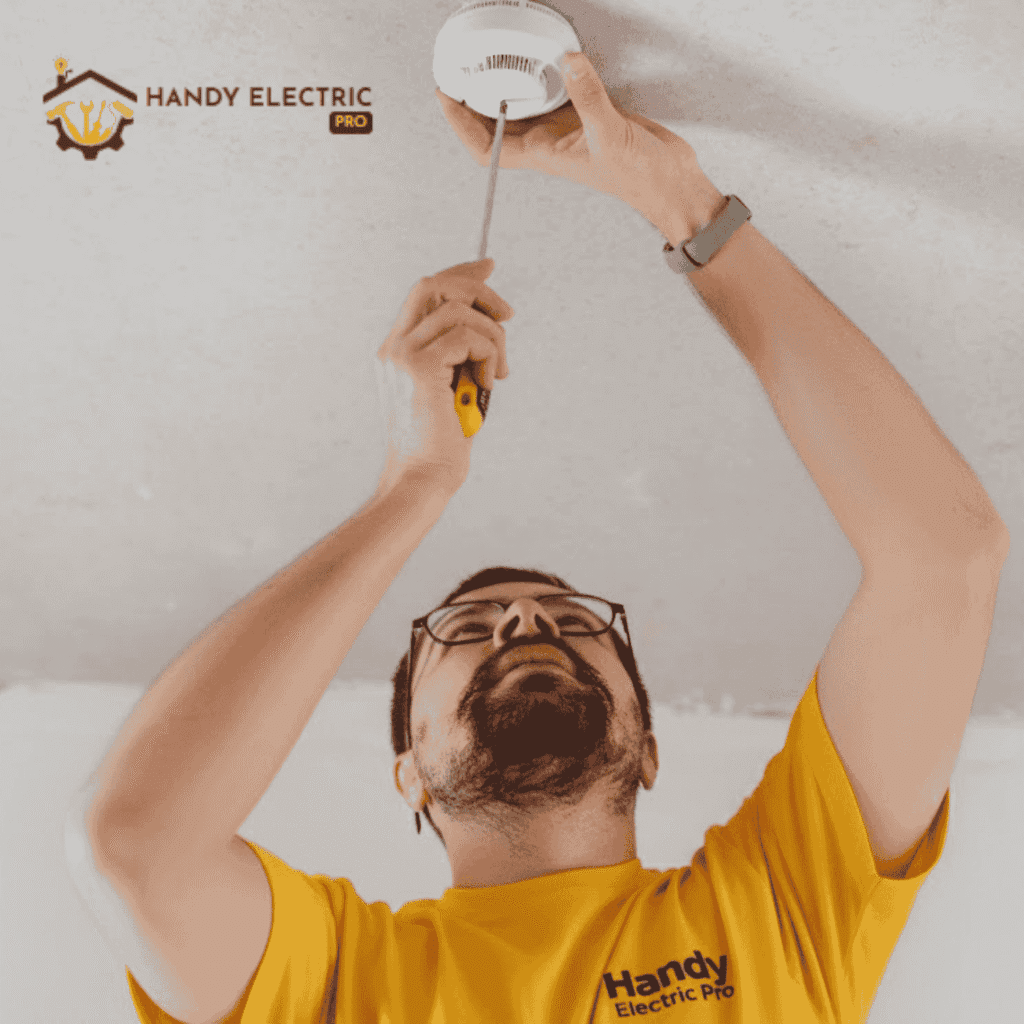 electrician installing a heat alarm (1)